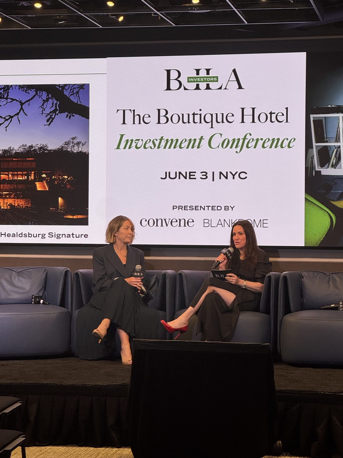 Irina Zavina-Tare in conversation on stage at the BLLA Boutique Hotel Investment Conference, New York City